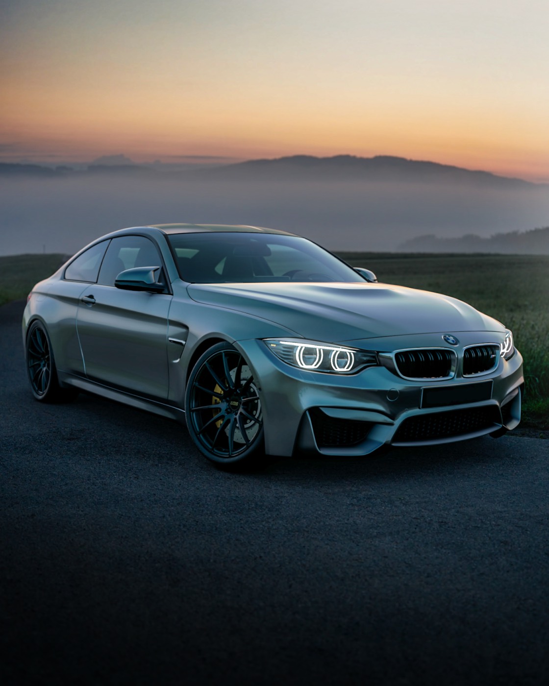 Polished BMW coupe at dusk showing showroom finish